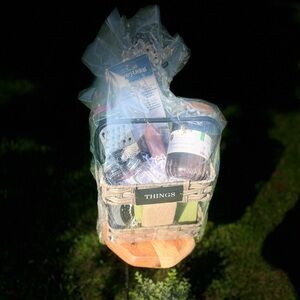 A basket full of “things” containing kitchen items